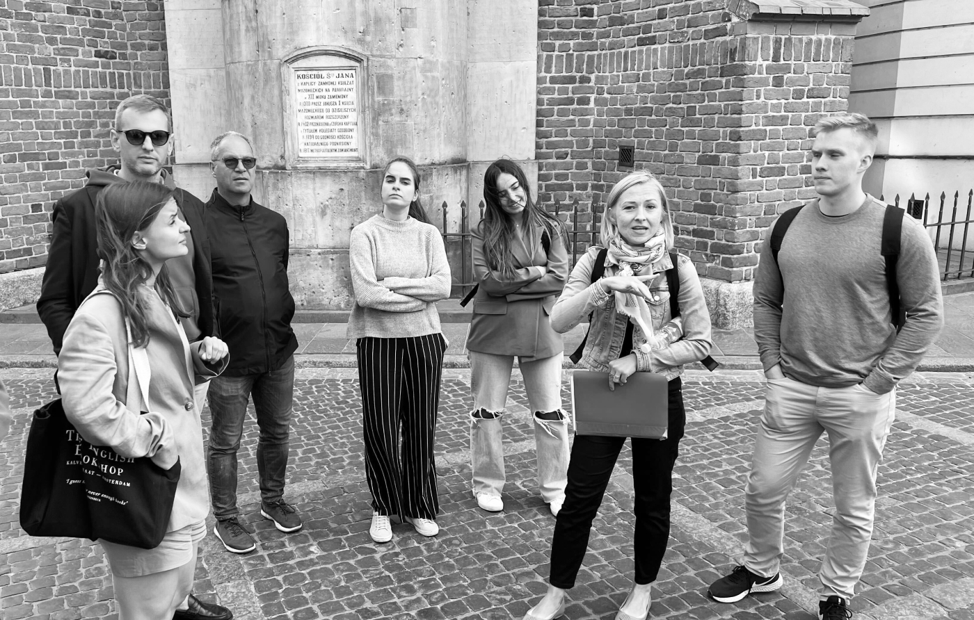 A black and white photograph of Adam in a city tour during one of Hyphen's co-working retreats.