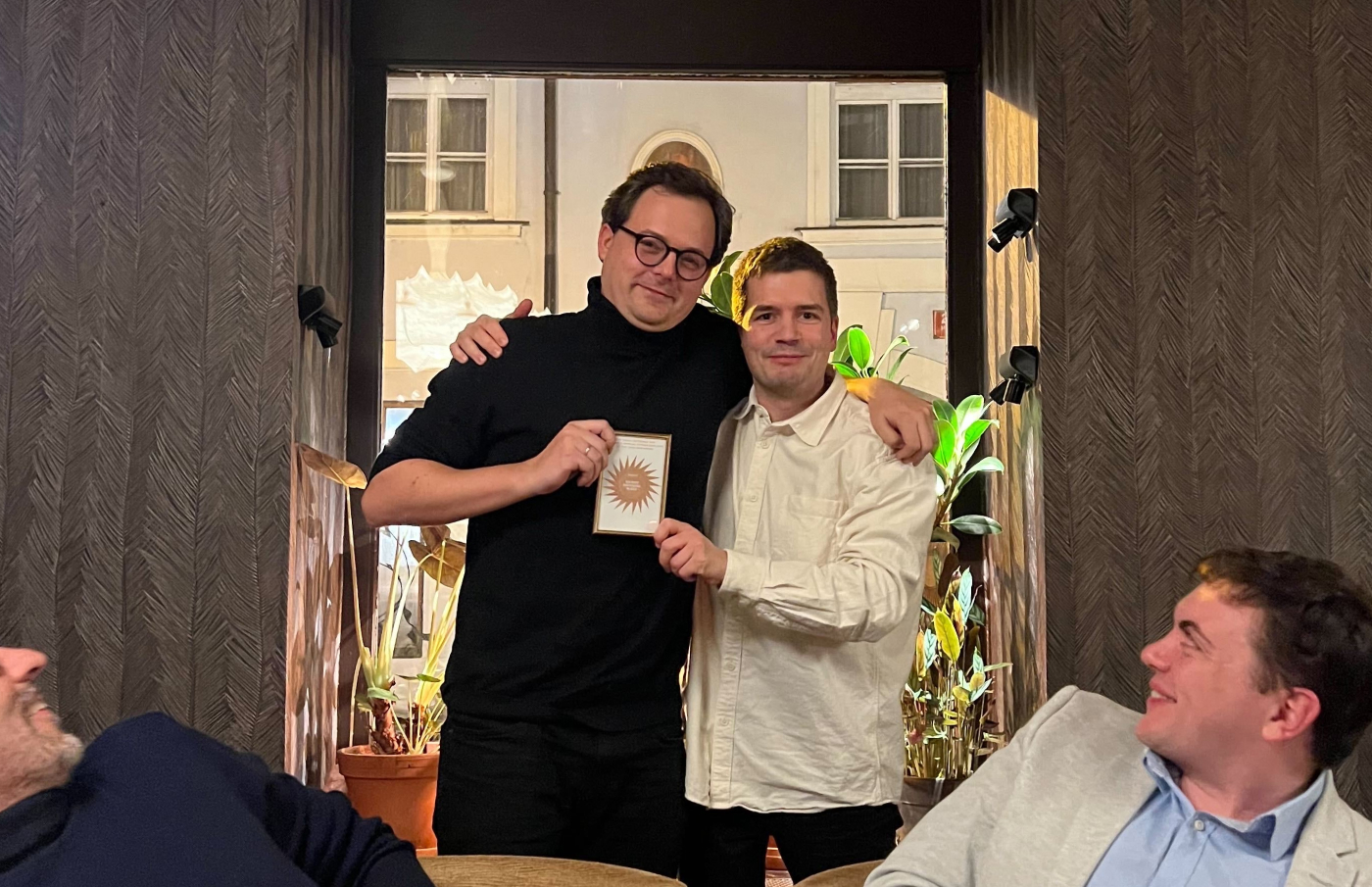 Olgierd and Patrick holding a "Hyphie" award.